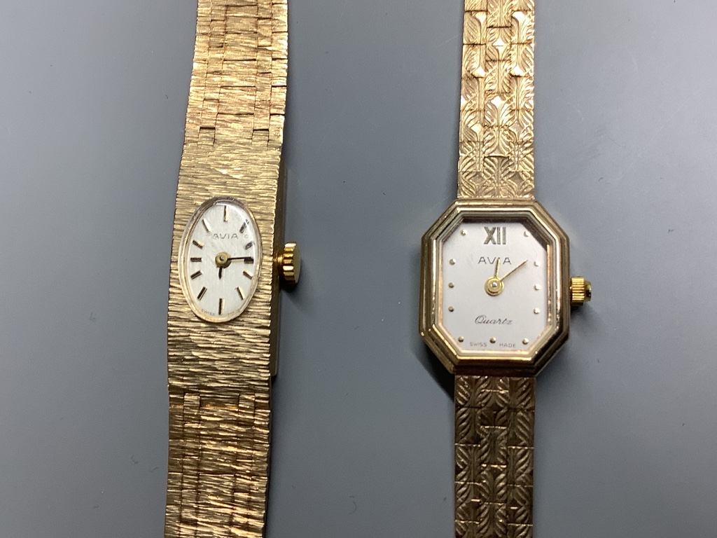 Two lady's modern 9ct gold Avia wrist watches on 9ct gold bracelets, one quartz, one manual wind bracelet watch